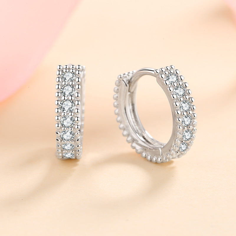 Moissanite stud earrings in 925 sterling silver – worn on ear