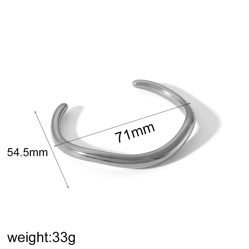 Irregular open cuff bracelet in stainless steel – worn on wrist