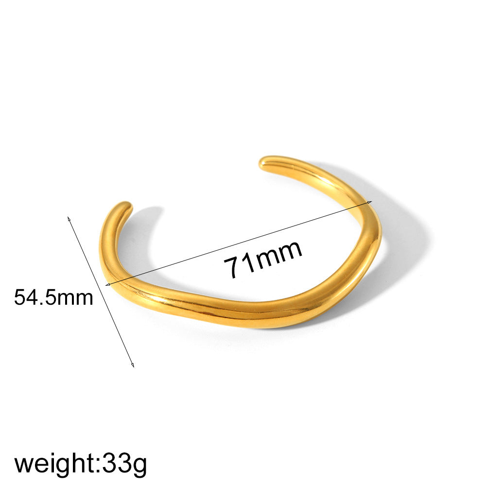 Irregular open cuff bracelet in stainless steel – gold tone